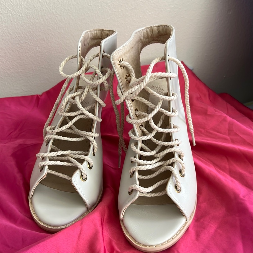 Beige colored lace up sandals